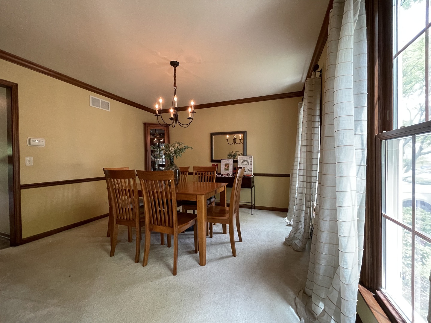 2006 Dorset Drive Wheaton, IL 60189 - Photo 5 of 10 a dining room with furniture a chandelier and a rug