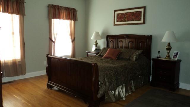 5 Pondview Circle, Unit 5 Beacon Falls, CT 06403 - Photo 11 of 18 a bed sitting in a bedroom next to a window
