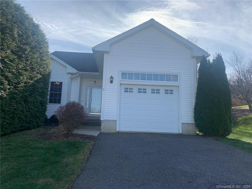 5 Pondview Circle, Unit 5 Beacon Falls, CT 06403 - Photo 4 of 18 a front view of a house with a yard and garage