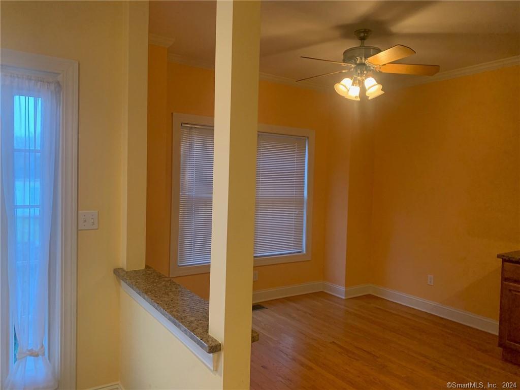 5 Pondview Circle, Unit 5 Beacon Falls, CT 06403 - Photo 6 of 18 a view of a livingroom with wooden floor
