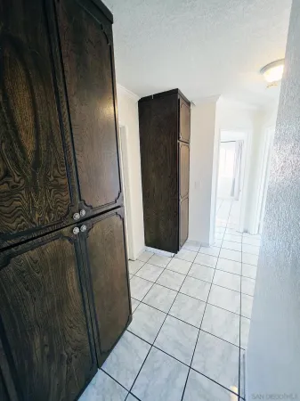 a view of a refrigerator in kitchen