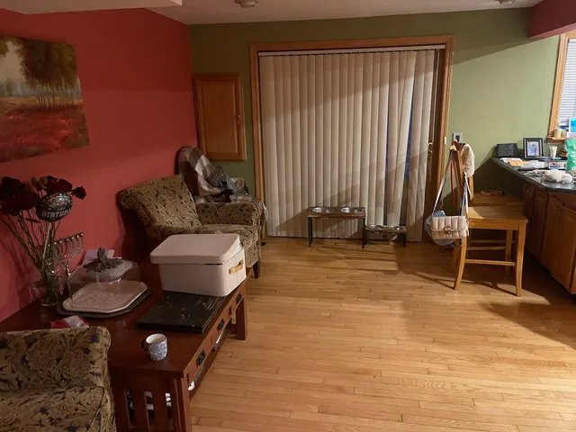 a room with furniture a rug and a window