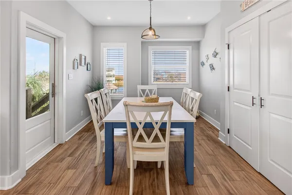 a dining room with furniture window wooden floor
