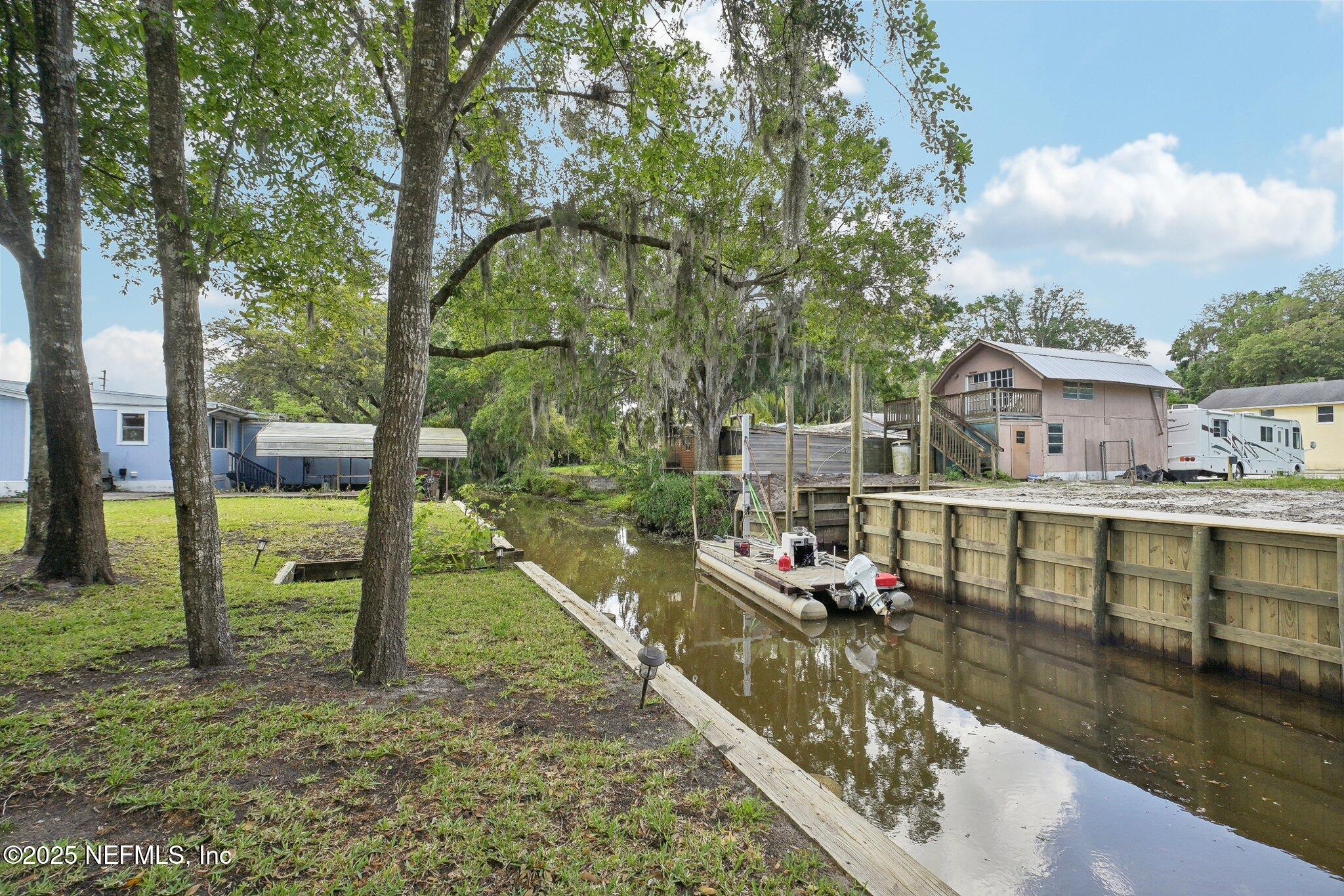 8145 Colee Cove Road St. Augustine, FL 32092 - Photo 1 of 35 a view of a house with a yard from a balcony