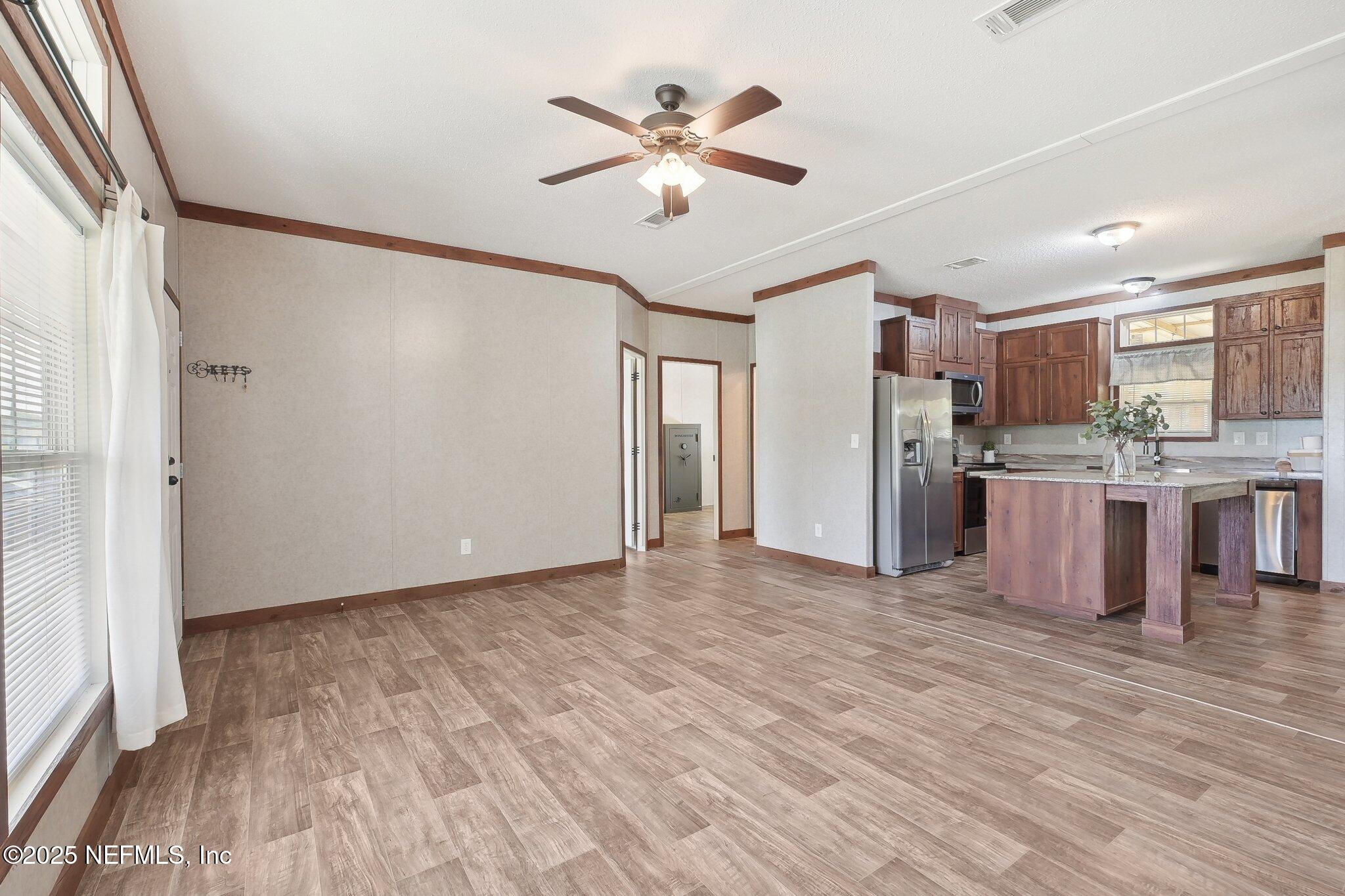 8145 Colee Cove Road St. Augustine, FL 32092 - Photo 11 of 35 a view of kitchen with cabinets and wooden floor