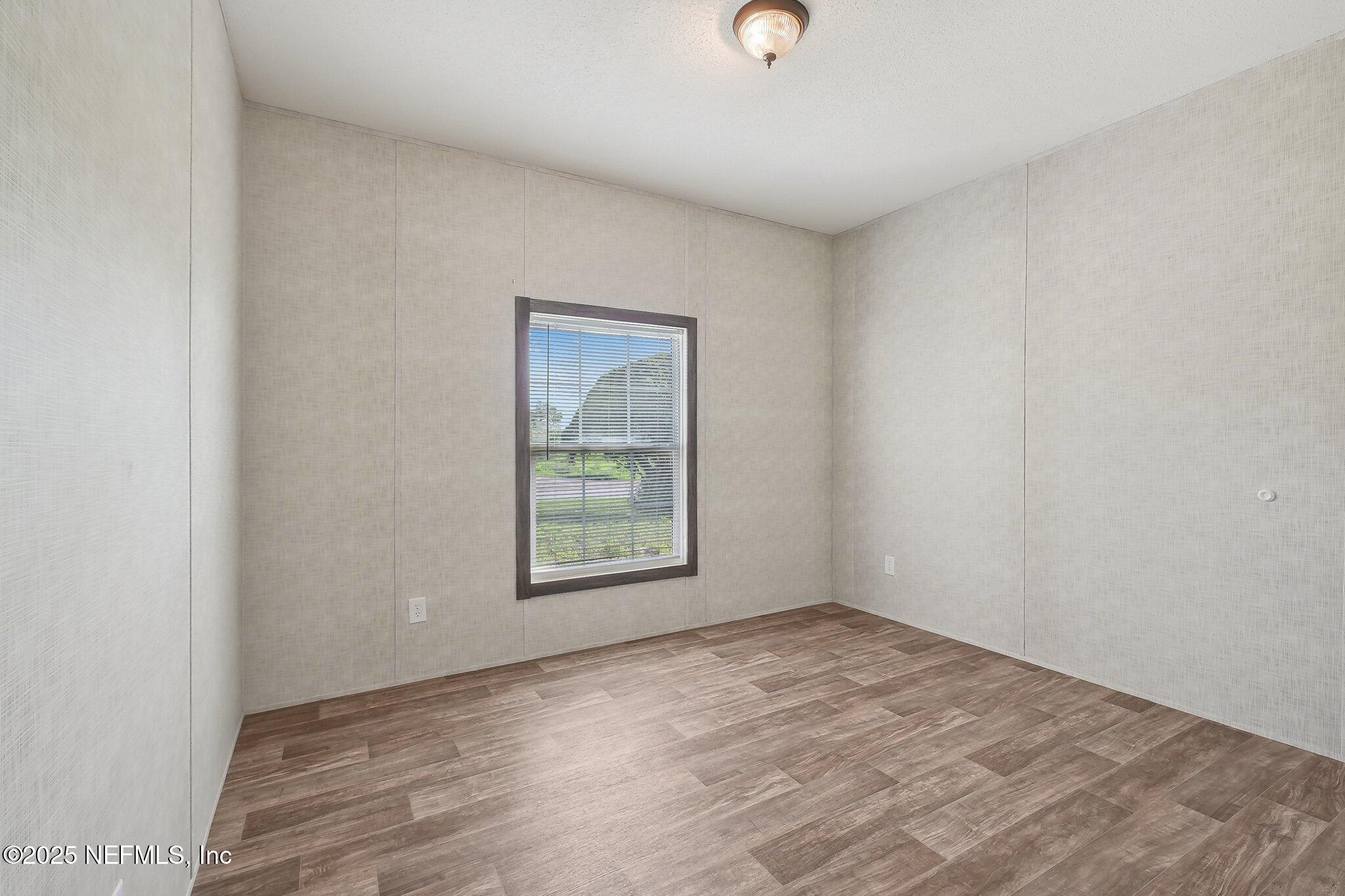 8145 Colee Cove Road St. Augustine, FL 32092 - Photo 20 of 35 an empty room with a window