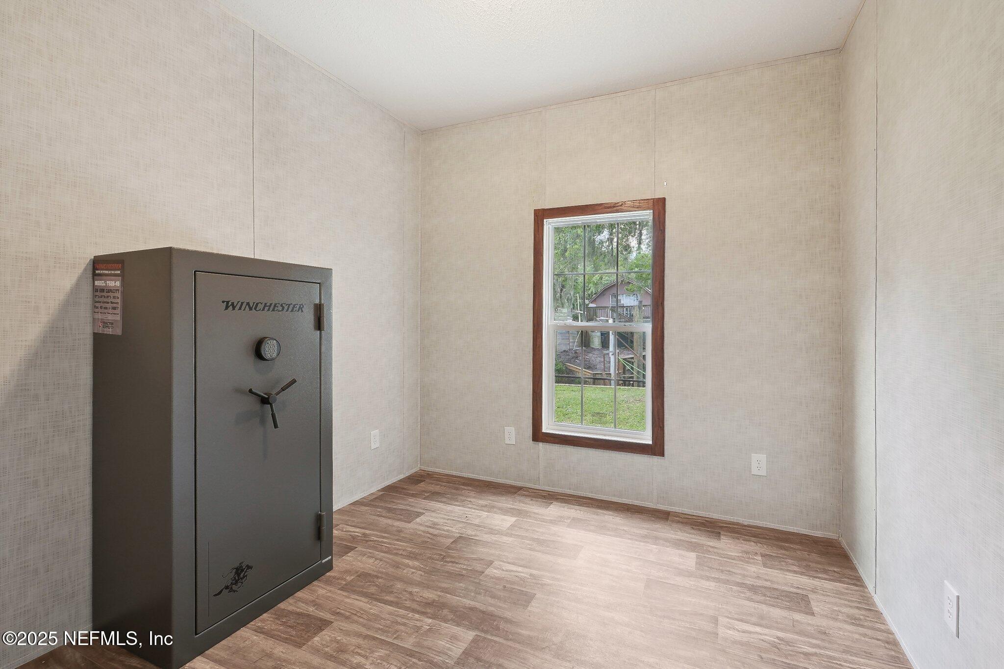 8145 Colee Cove Road St. Augustine, FL 32092 - Photo 22 of 35 an empty room with windows and closet