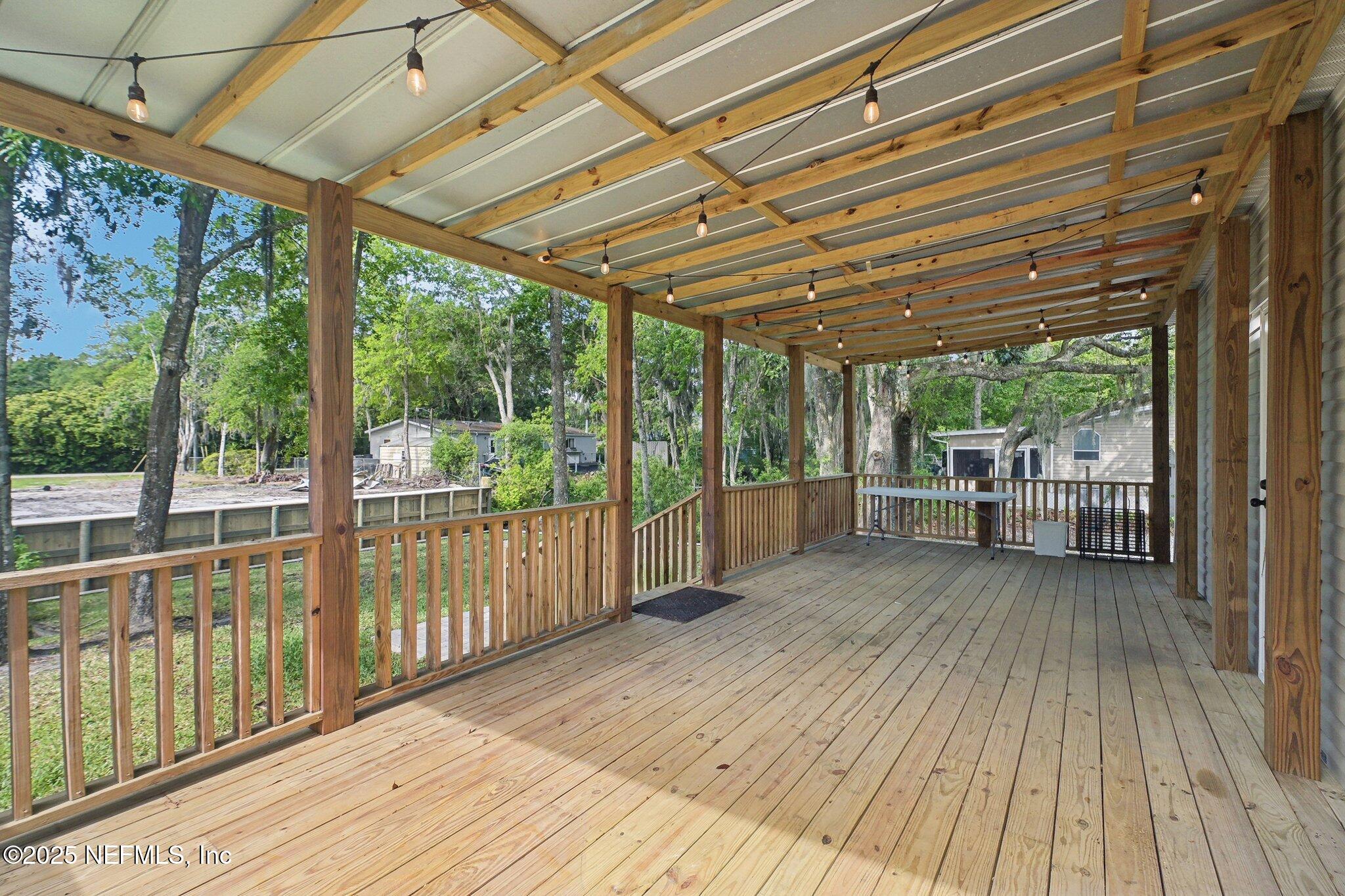8145 Colee Cove Road St. Augustine, FL 32092 - Photo 3 of 35 a view of a room with wooden floor and roof