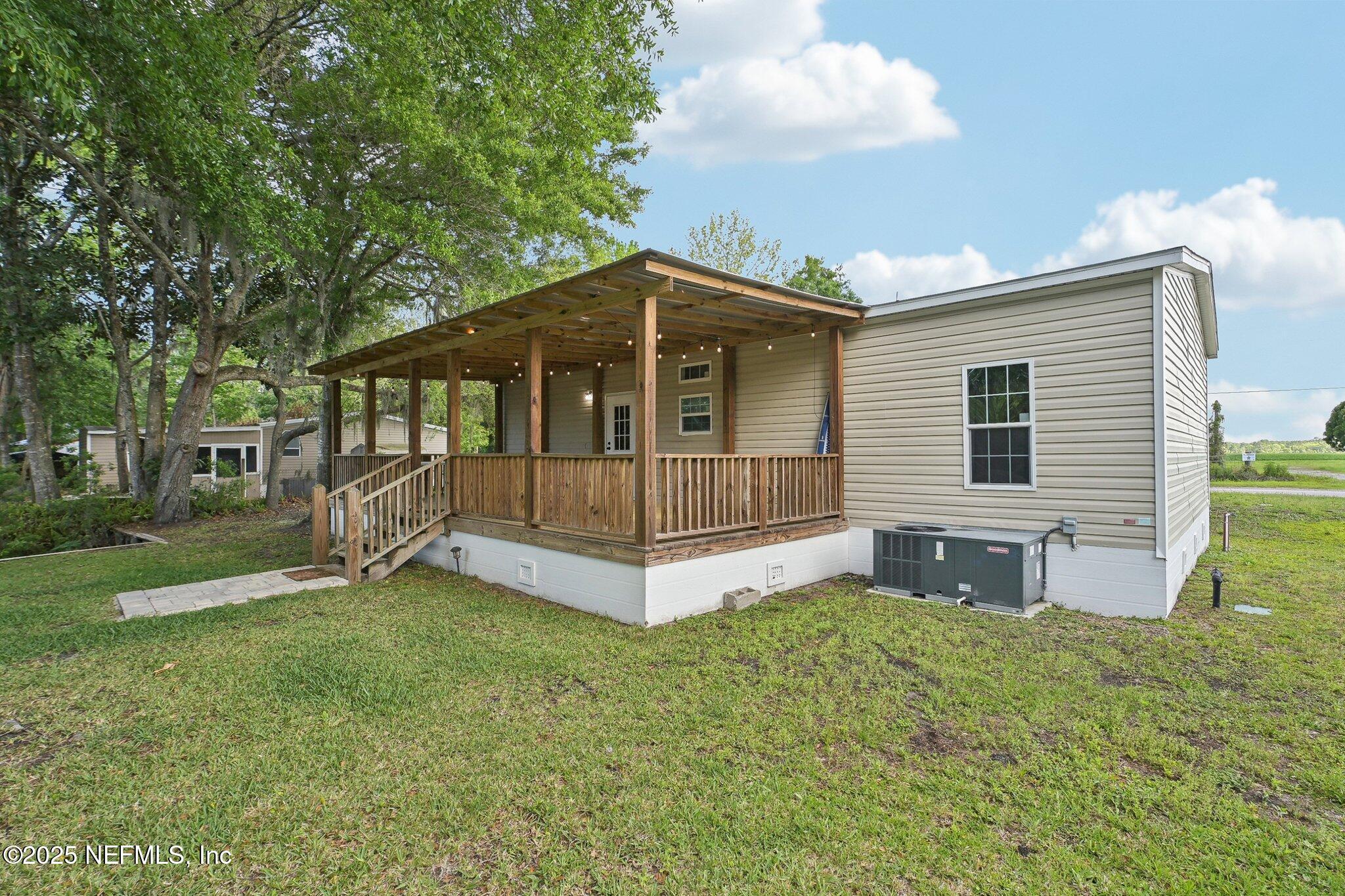8145 Colee Cove Road St. Augustine, FL 32092 - Photo 31 of 35 a view of a house with a yard