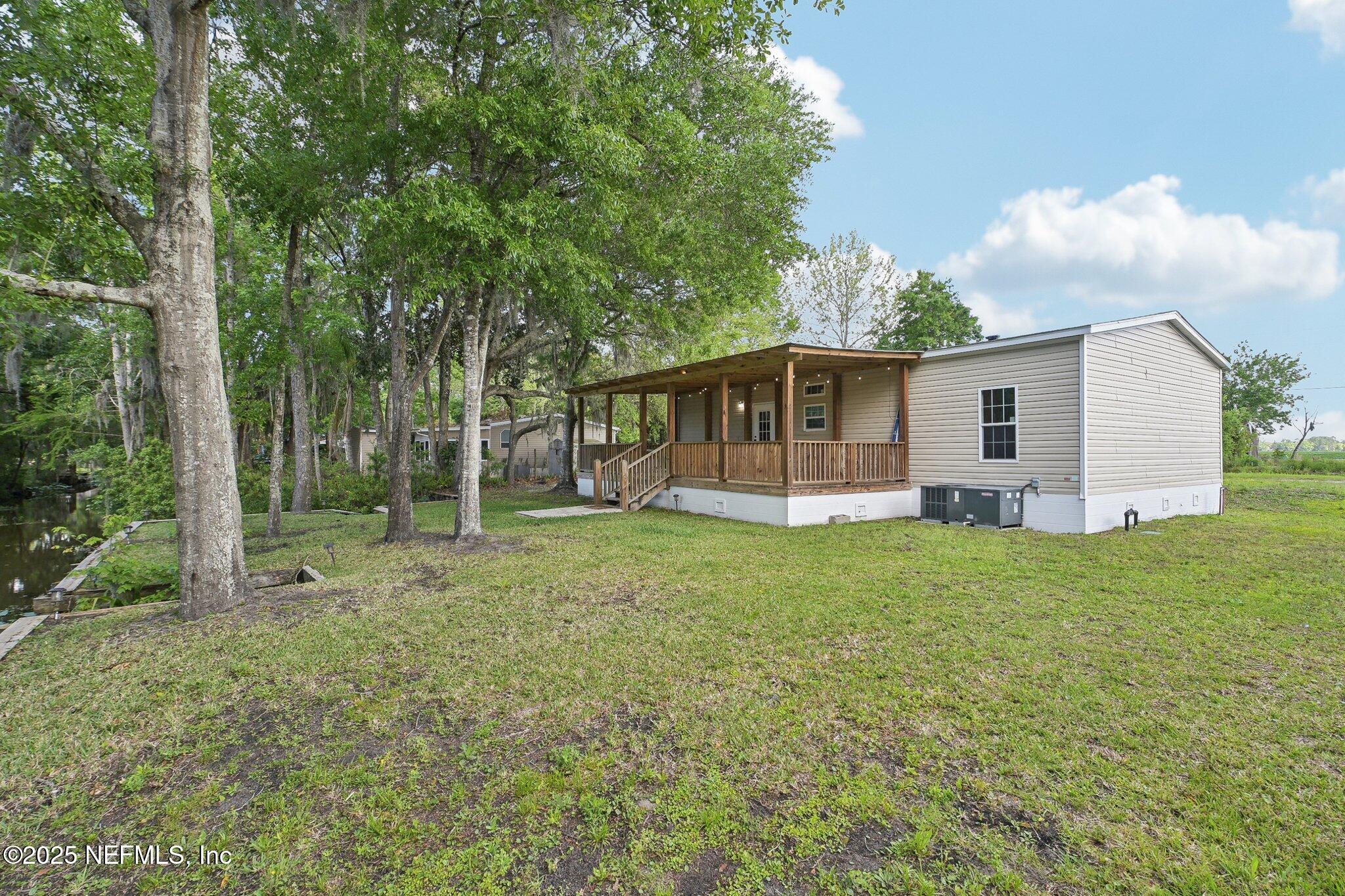 8145 Colee Cove Road St. Augustine, FL 32092 - Photo 32 of 35 a view of a house with backyard and garden