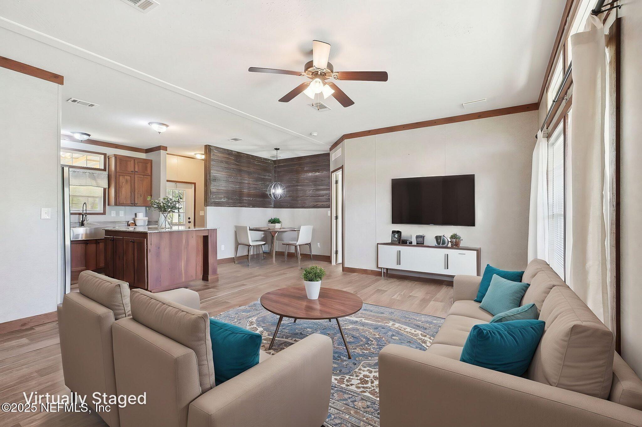 8145 Colee Cove Road St. Augustine, FL 32092 - Photo 4 of 35 a living room with furniture and a flat screen tv
