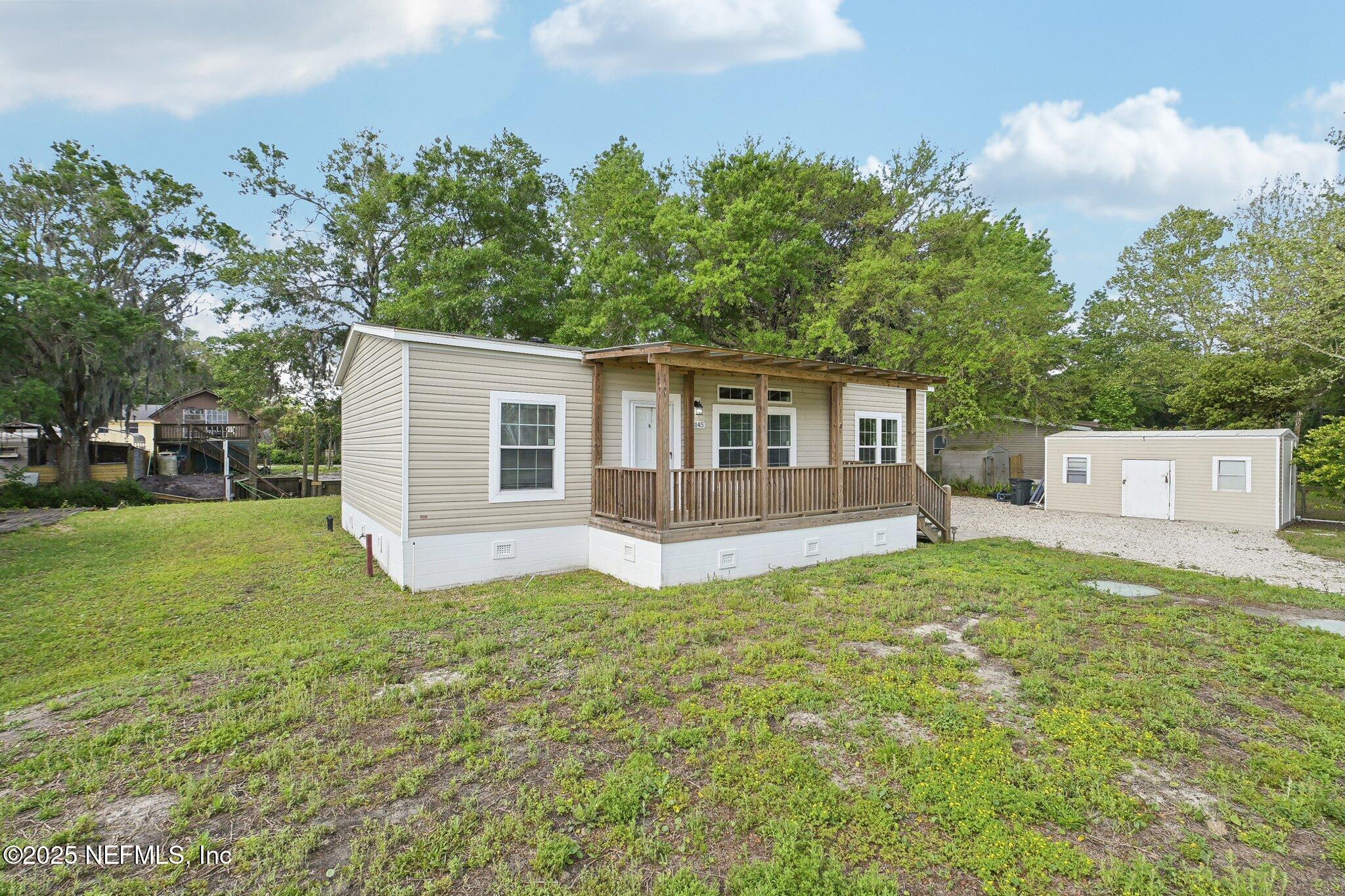 8145 Colee Cove Road St. Augustine, FL 32092 - Photo 8 of 35 a view of a house with a yard