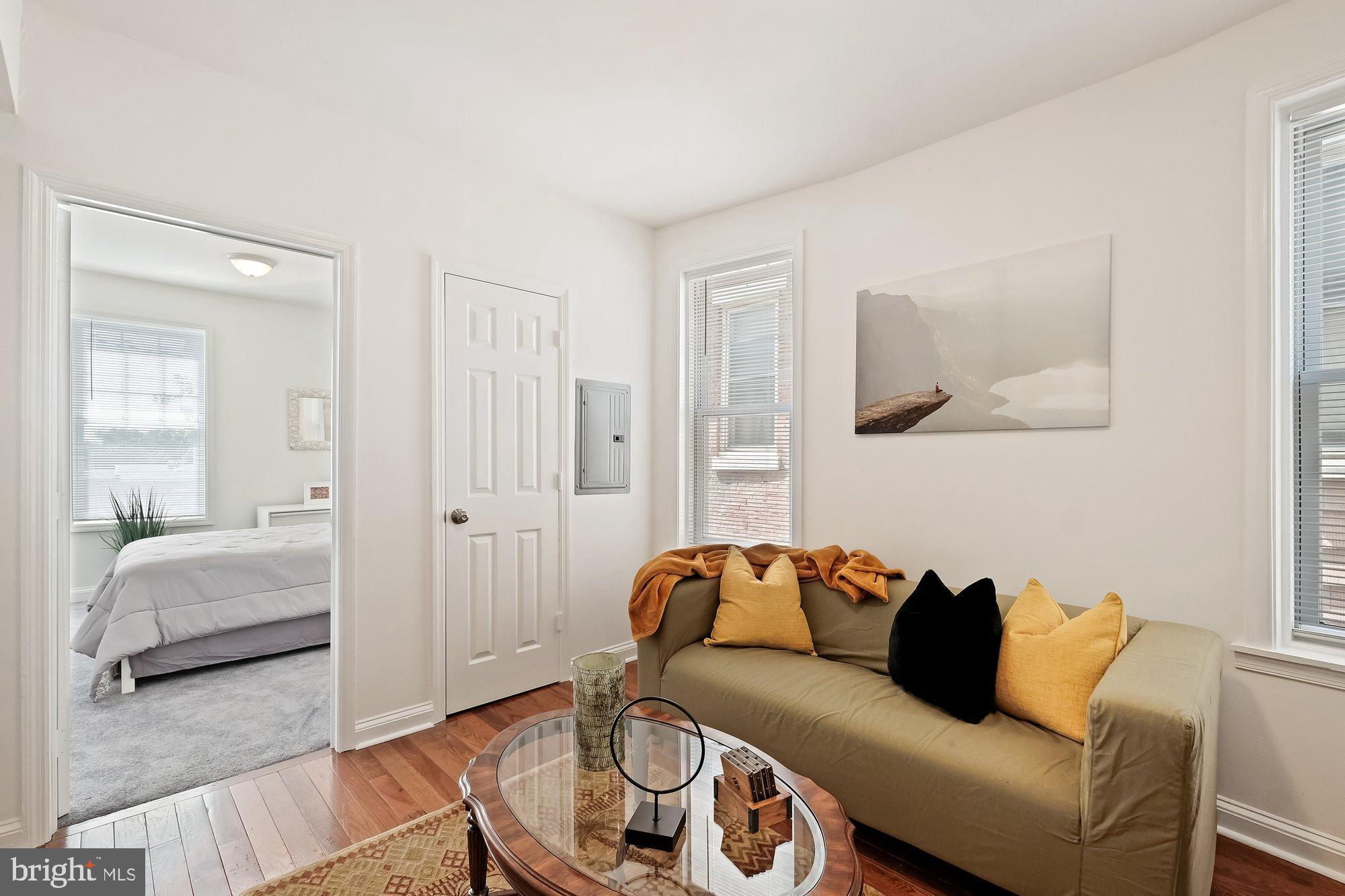 468 East Walnut Lane, Unit 2 Philadelphia, PA 19144 - Photo 9 of 13 a living room with furniture and a couch