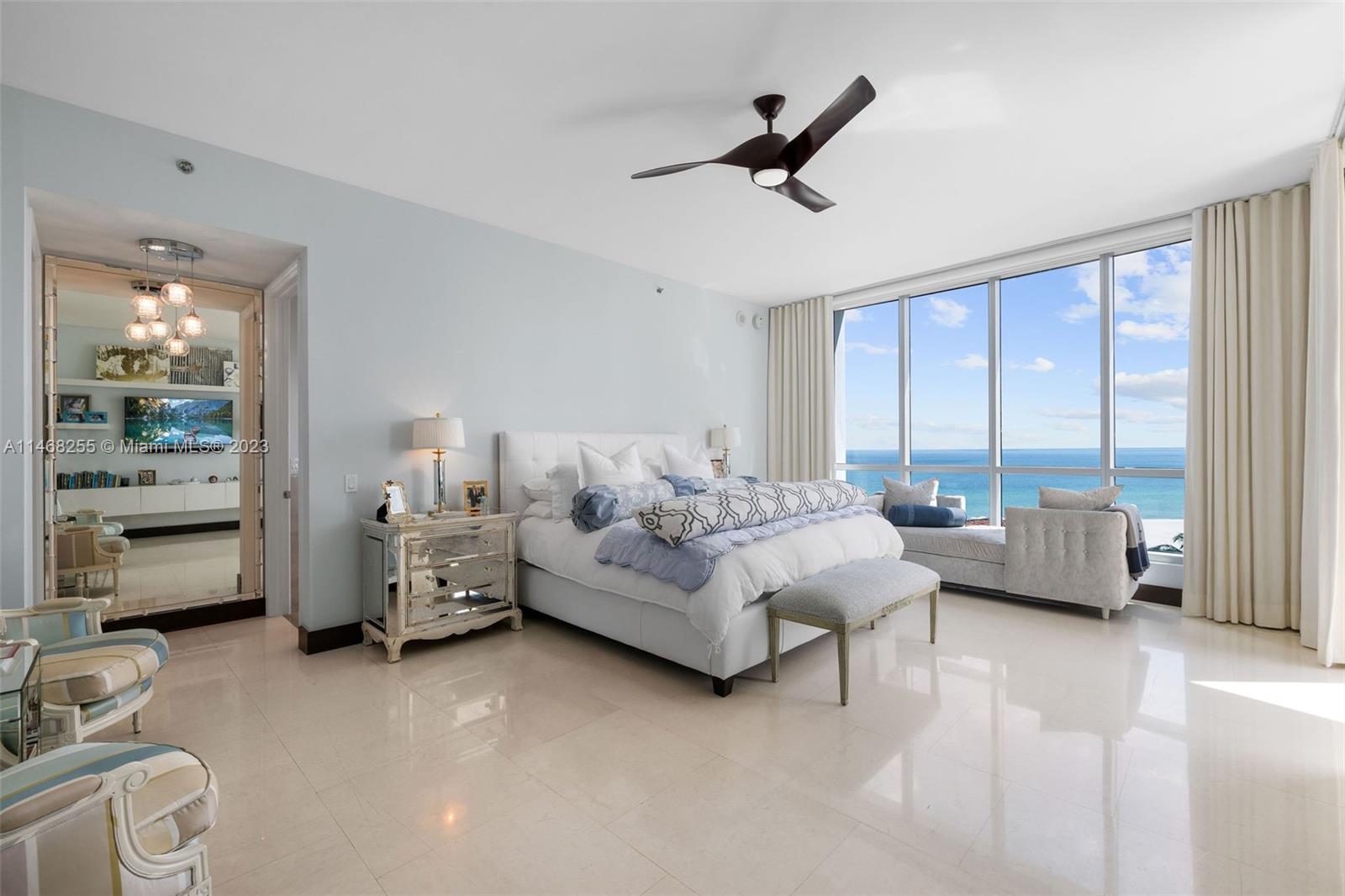 5959 Collins Avenue, Unit 902 Miami Beach, FL 33140 - Photo 12 of 46 a living room with furniture and a large window