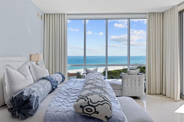 a bed room with a bed and a window