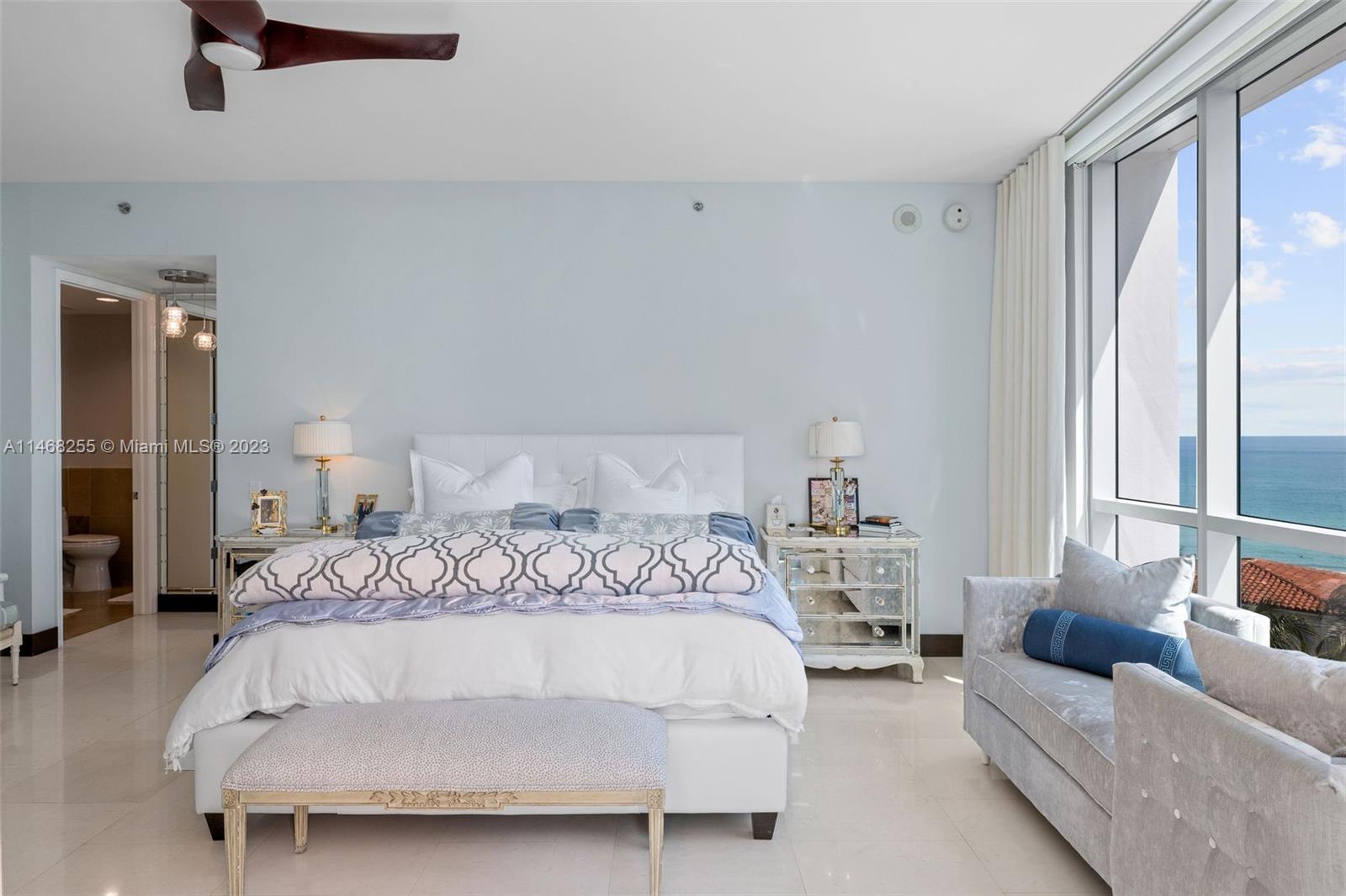 5959 Collins Avenue, Unit 902 Miami Beach, FL 33140 - Photo 15 of 46 a bed room with a bed and a window