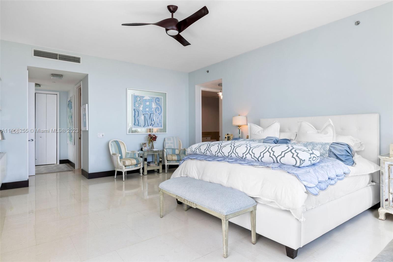 5959 Collins Avenue, Unit 902 Miami Beach, FL 33140 - Photo 16 of 46 a bedroom with a bed and a couch