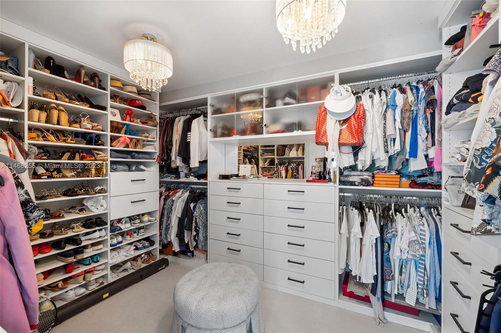5959 Collins Avenue, Unit 902 Miami Beach, FL 33140 - Photo 17 of 46 a view of walk in closet with clothes and shoes
