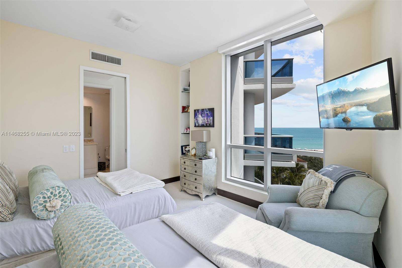 5959 Collins Avenue, Unit 902 Miami Beach, FL 33140 - Photo 25 of 46 a bedroom with furniture and a large window