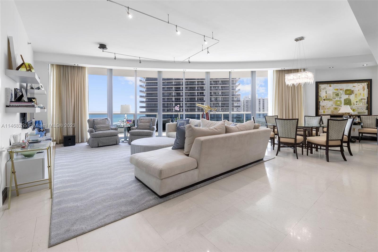 5959 Collins Avenue, Unit 902 Miami Beach, FL 33140 - Photo 3 of 46 a living room with furniture and a large window