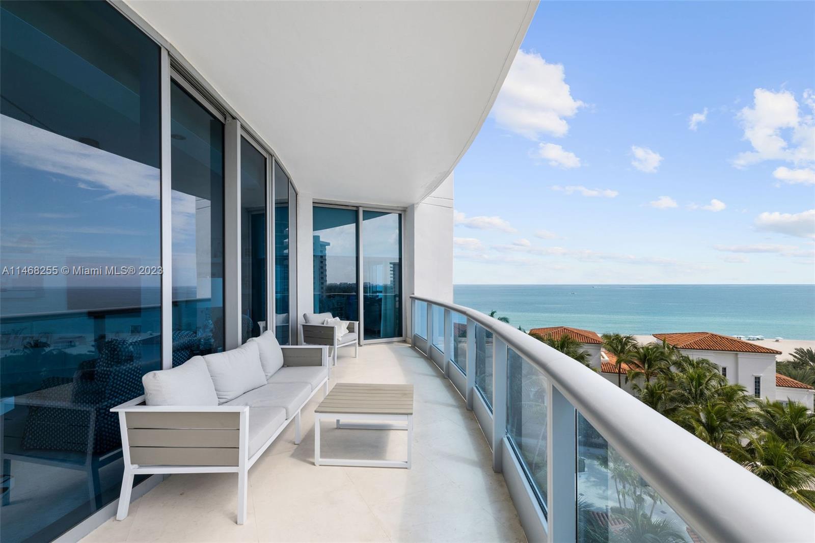 5959 Collins Avenue, Unit 902 Miami Beach, FL 33140 - Photo 34 of 46 a balcony with furniture and city view