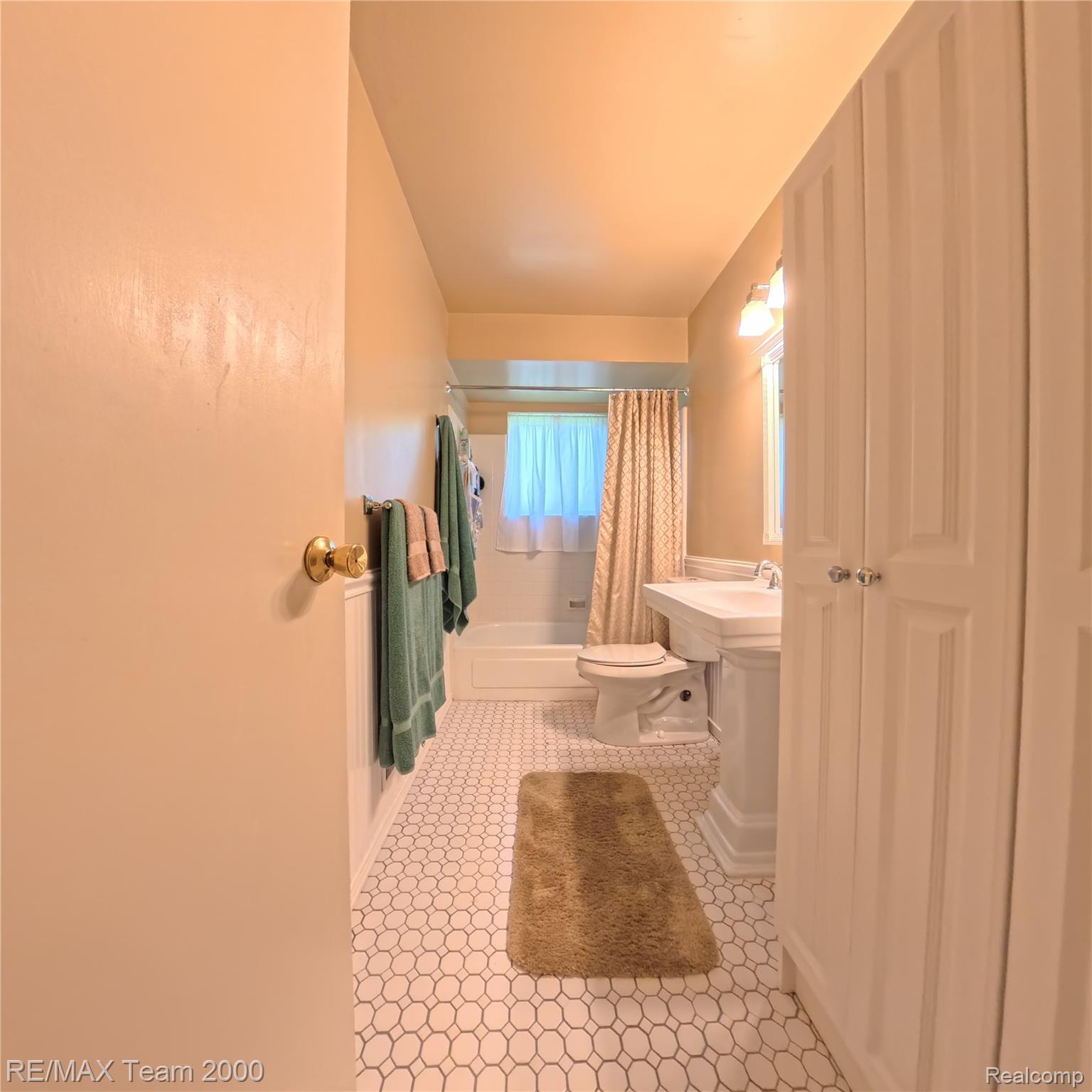 2104 Whittier Road Ypsilanti, MI 48197 - Photo 17 of 45 Bathroom featuring shower / tub combo and light tile patterned flooring