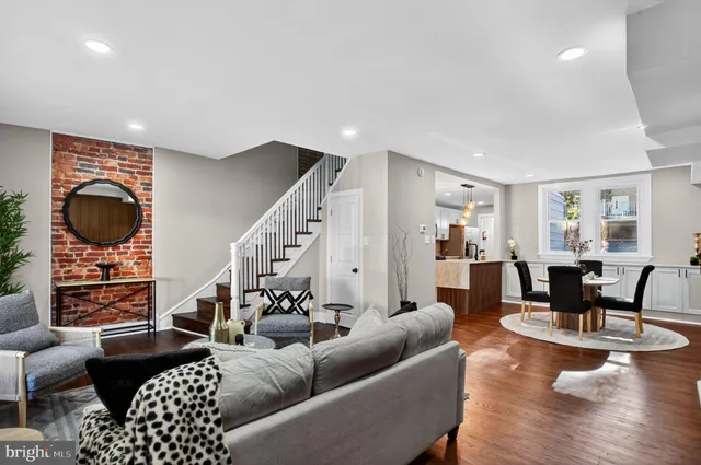 a living room with furniture or wooden floor and a chandelier