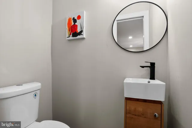 a bathroom with a toilet and a sink