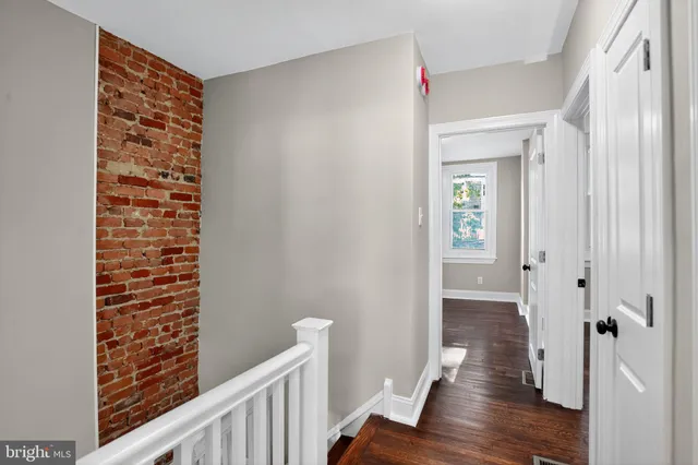 a view of entryway with wooden floor