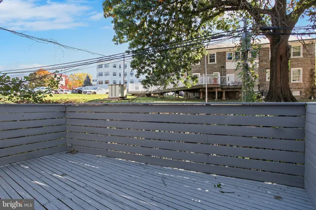 a view of a house with a large tree