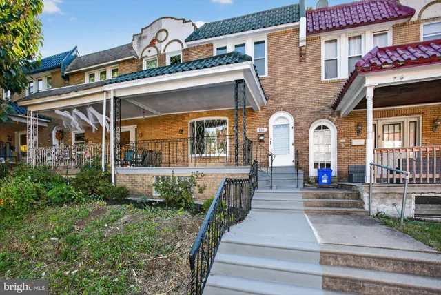 a front view of a house with lots of garden