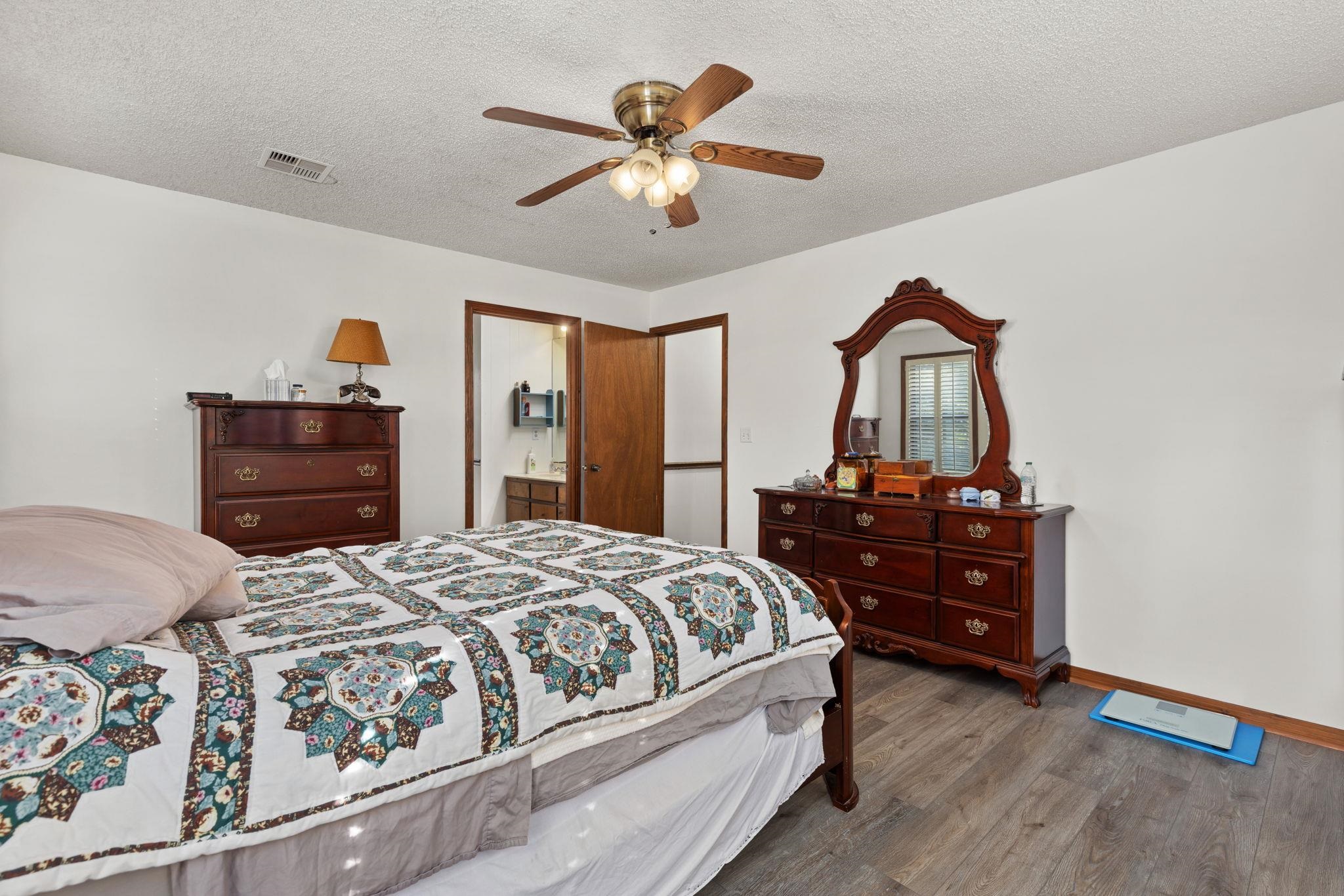 11 Barnstable Road Corinth, MS 38834 - Photo 15 of 40 a bedroom with a bed and a dresser