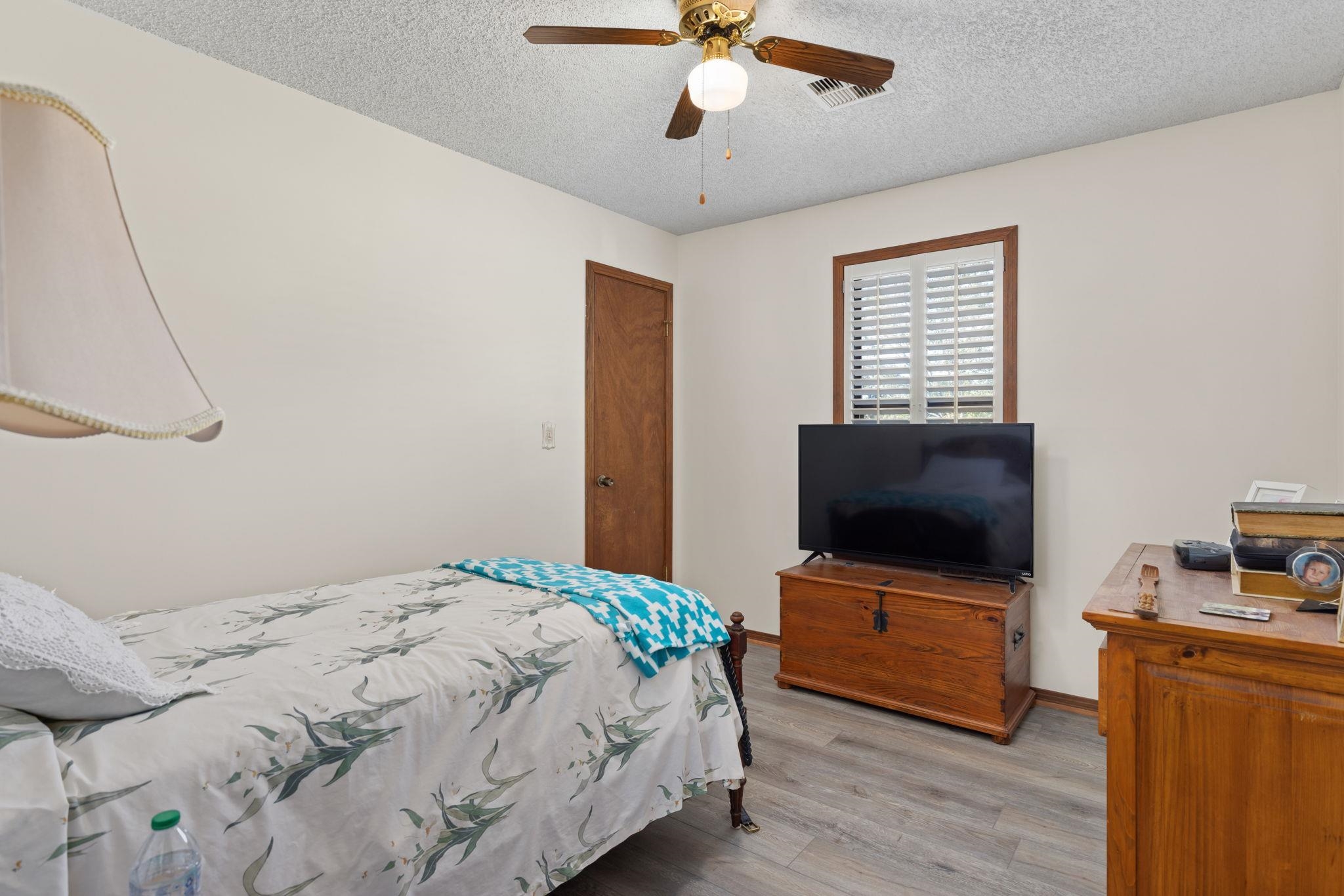 11 Barnstable Road Corinth, MS 38834 - Photo 18 of 40 a bedroom with a bed and a flat screen tv