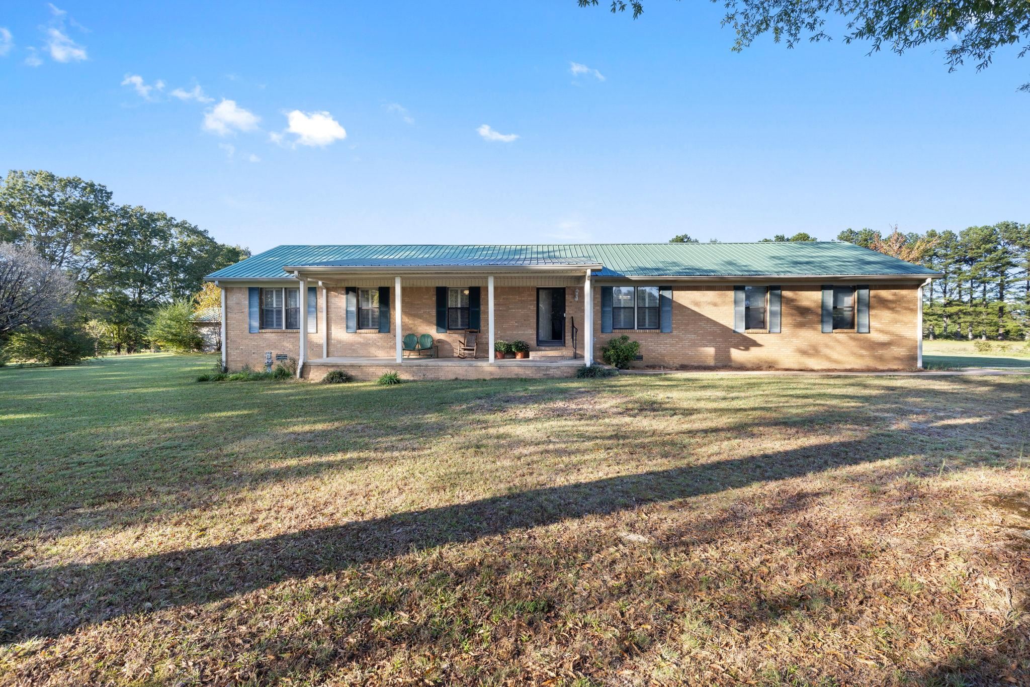 11 Barnstable Road Corinth, MS 38834 - Photo 3 of 40 a view of house with outdoor space and swimming pool