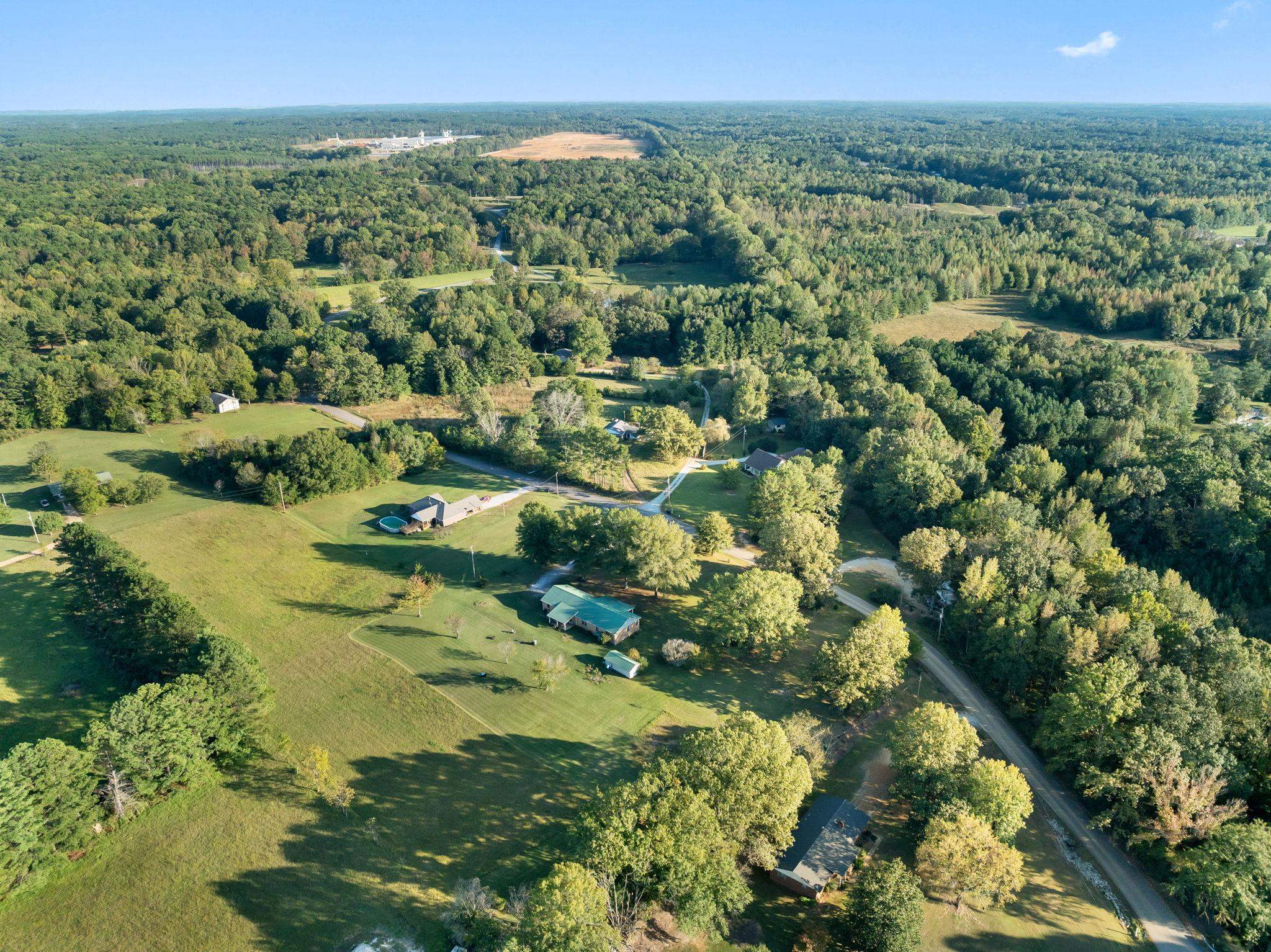 11 Barnstable Road Corinth, MS 38834 - Photo 31 of 40 an aerial view of residential houses with outdoor space and trees