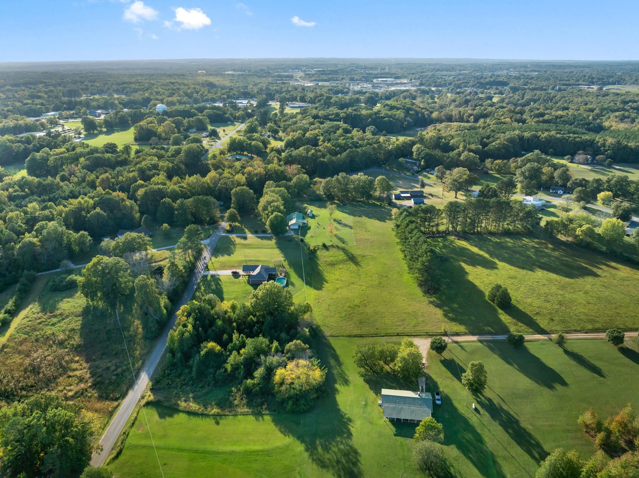 11 Barnstable Road Corinth, MS 38834 - Photo 37 of 40 an aerial view of residential houses with outdoor space and trees