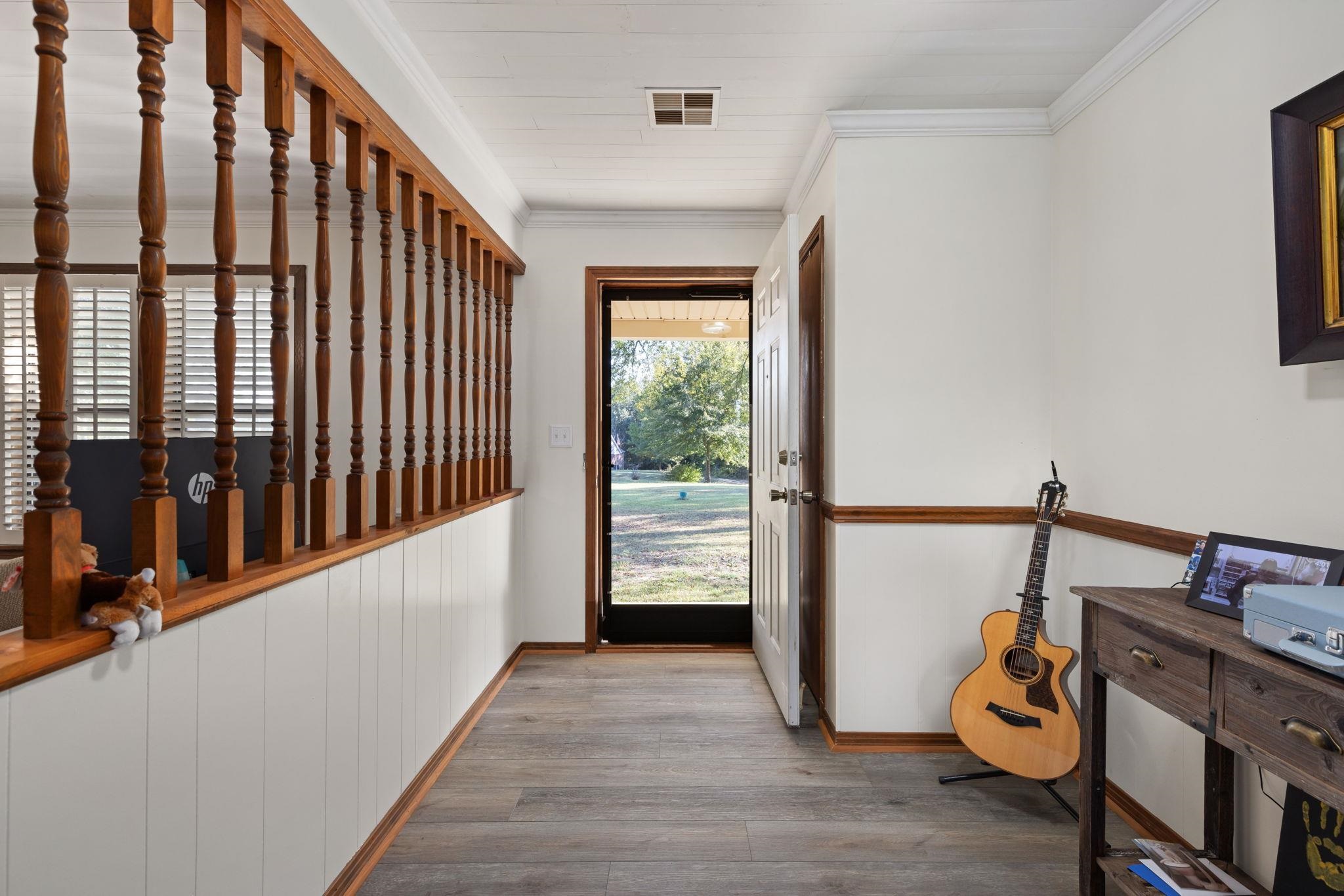 11 Barnstable Road Corinth, MS 38834 - Photo 6 of 40 a hallway with sliding door and stairs