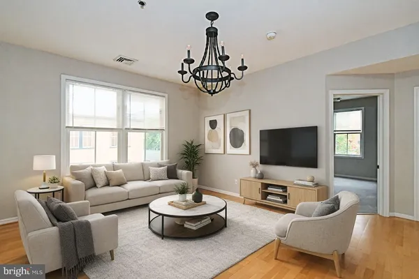 a living room with furniture and a flat screen tv