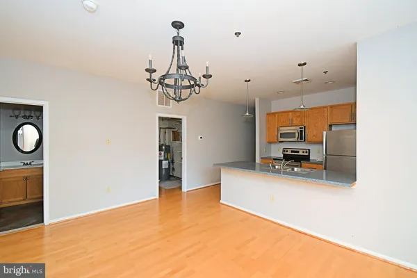 a view of a livingroom with furniture and a window