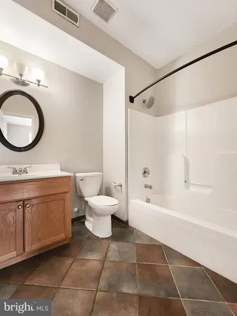 a bathroom with a sink a toilet and a bathtub