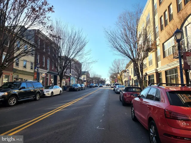 a city street lined with buildings and cars