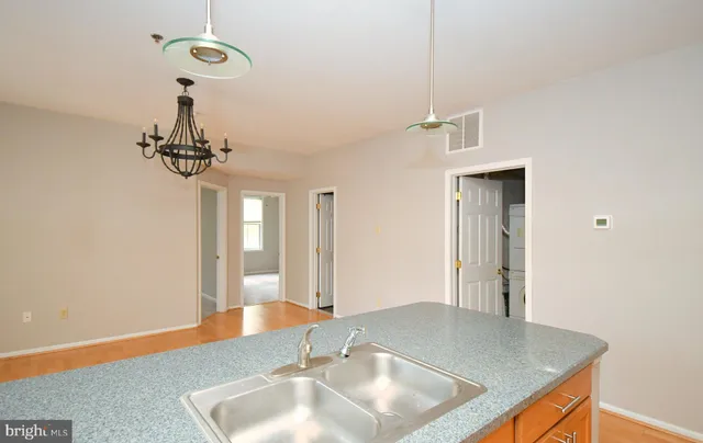 a bathroom with a sink vanity and a mirror