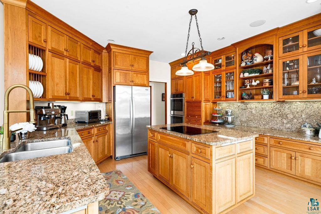 3168 Pioneer Road Barnum, MN 55707 - Photo 3 of 46 This kitchen features stunning floor to ceiling, custom maple cabinetry. Ample cabinet space, you'll find yourself with left over shelf space... such a rare find. The appliances are all newer, stainless steel.