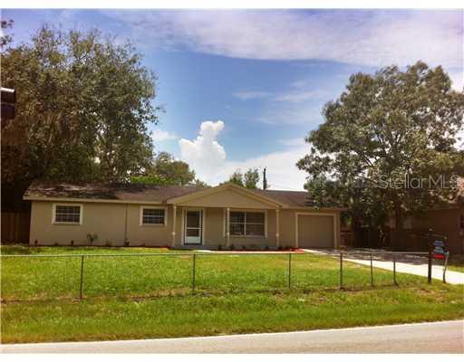 11209 McMullen Loop Riverview, FL 33569 - Photo 1 of 1 a view of a house with a yard