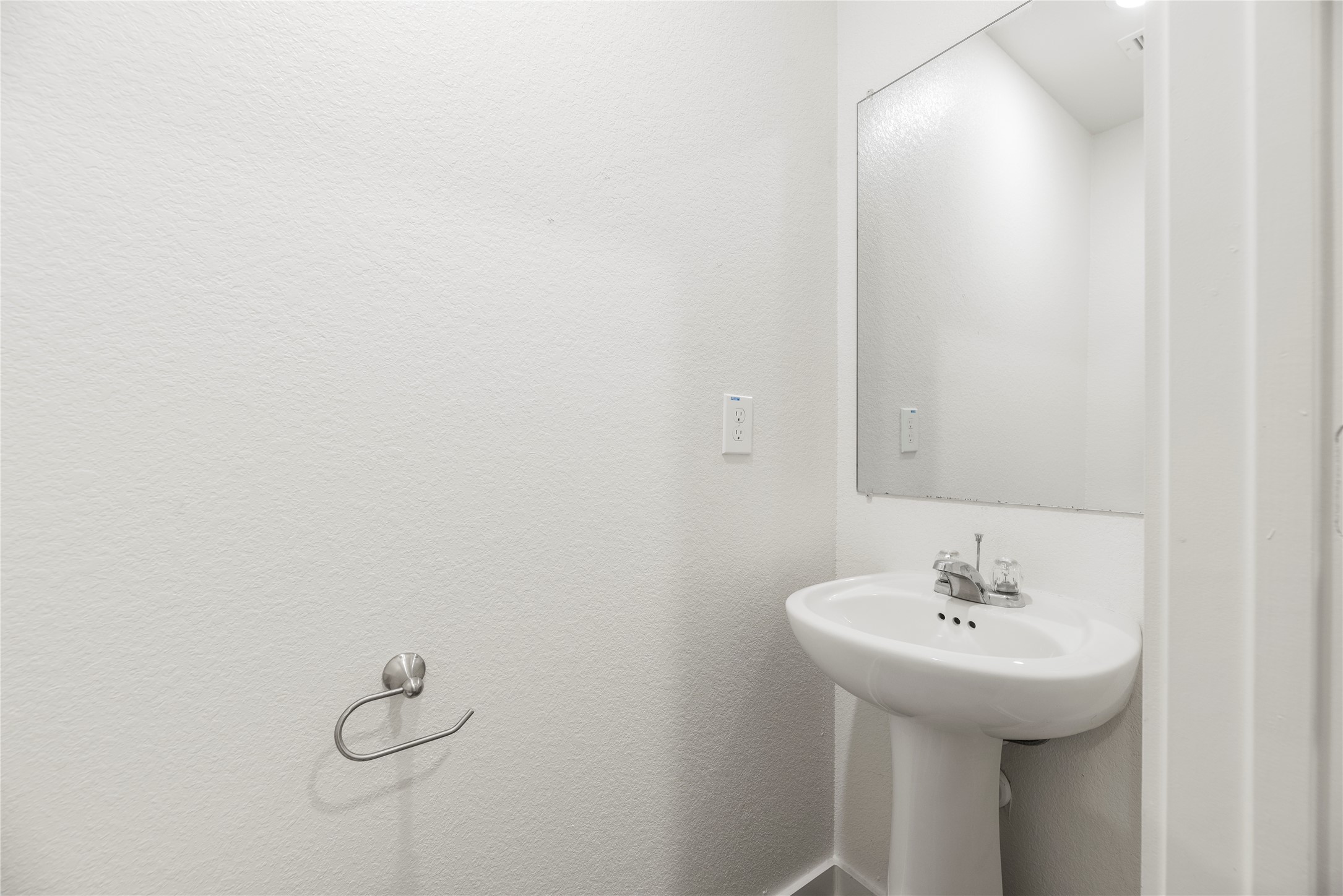 12603 Telge Road, Unit 1EH Cypress, TX 77429 - Photo 12 of 19 Half bathroom with a pedestal sink.
