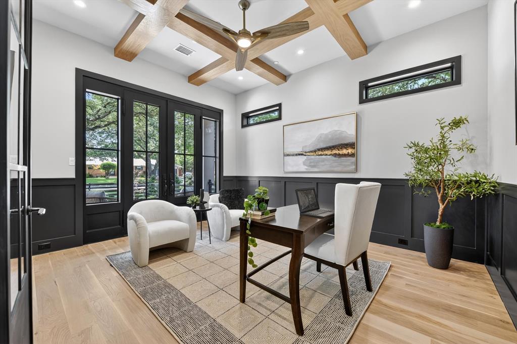 11028 Edgemere Road Dallas, TX 75230 - Photo 11 of 40 Room featuring a coffered ceiling with wood-finish beams, light wood-finish flooring, and a ceiling fan with integrated lighting