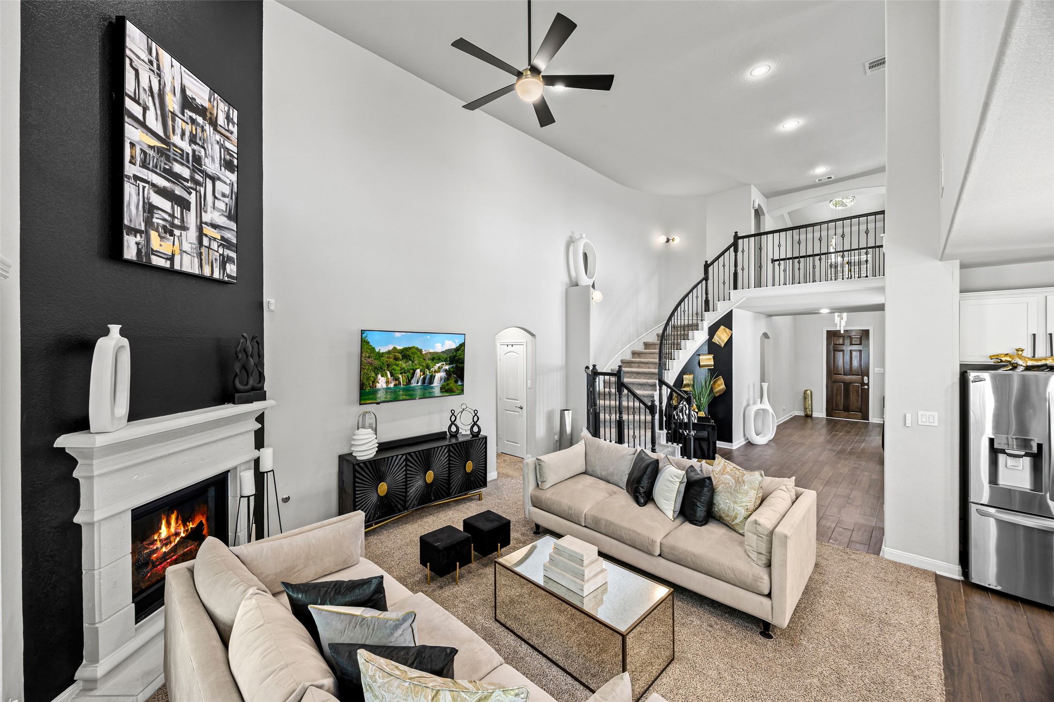 2823 Skerne Forest Drive Spring, TX 77373 - Photo 11 of 43 a living room with furniture a fireplace and a flat screen tv