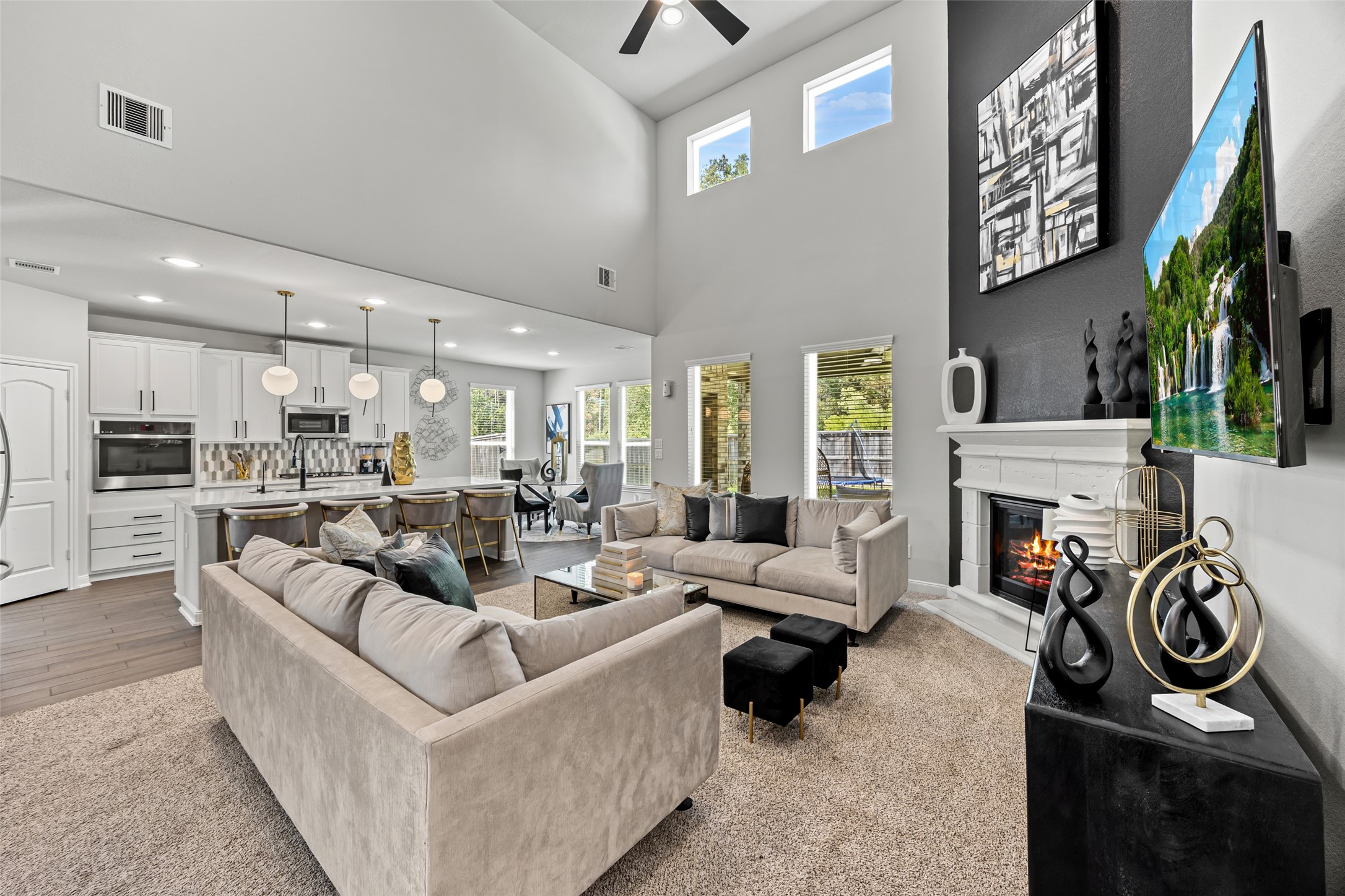 2823 Skerne Forest Drive Spring, TX 77373 - Photo 12 of 43 a living room with fireplace furniture and a flat screen tv