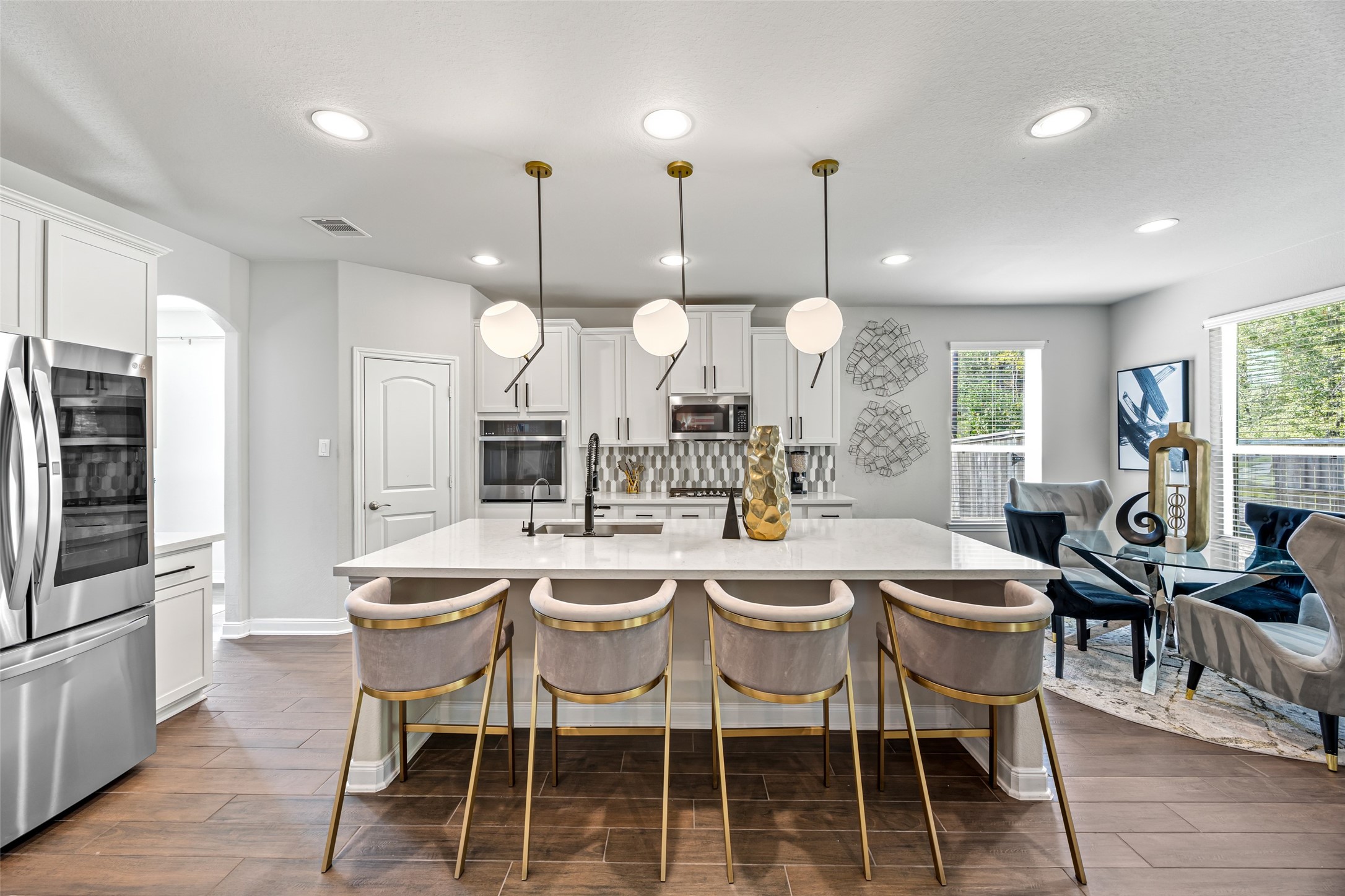 2823 Skerne Forest Drive Spring, TX 77373 - Photo 15 of 43 a large kitchen with a table and chairs