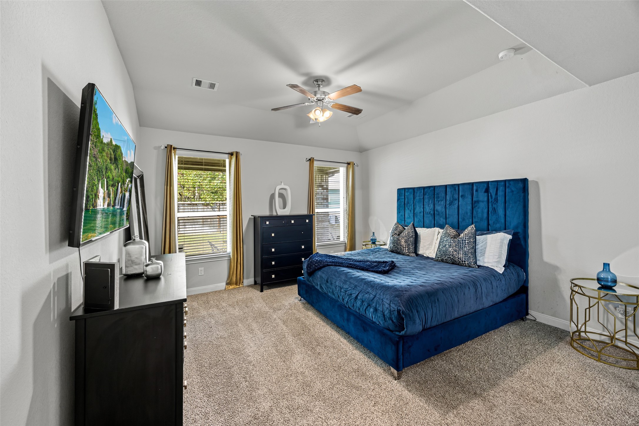 2823 Skerne Forest Drive Spring, TX 77373 - Photo 21 of 43 a spacious bedroom with a bed and a large window